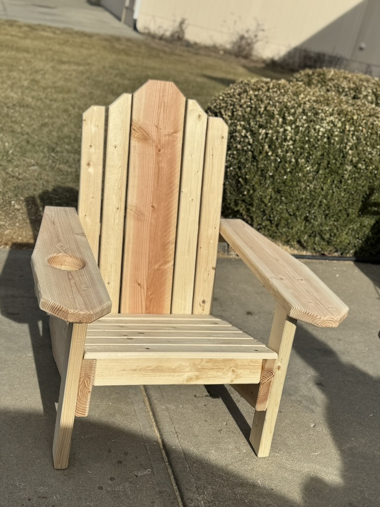 Matched pair of Adirondack chairs in natural wood finish