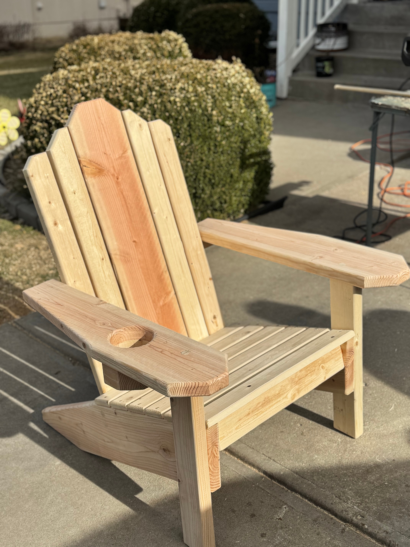 Handcrafted Adirondack chair on outdoor deck