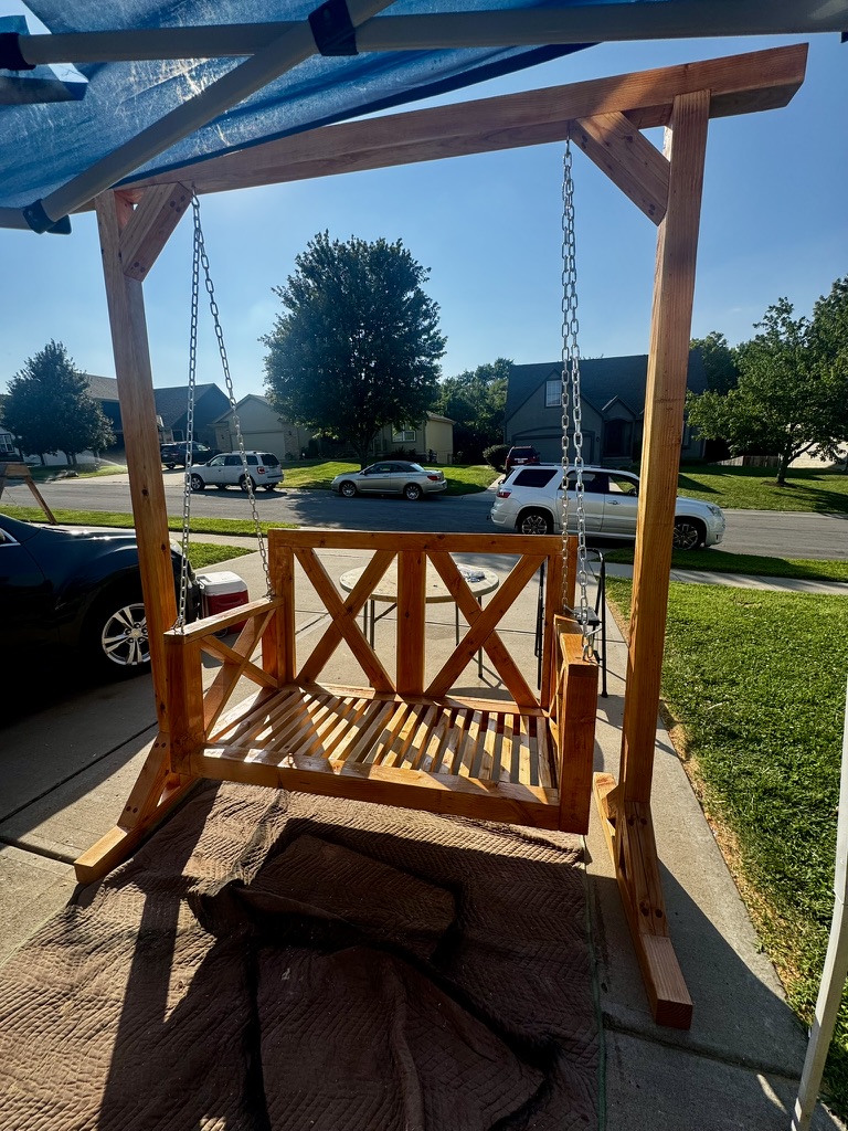 Completed hanging daybed with stand in outdoor setting